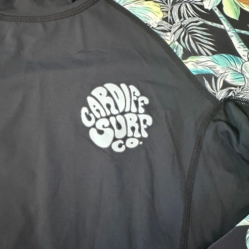 NWOT Rash Guard (unsure of brand) with Cardiff Surf Co Logo (Size L)
